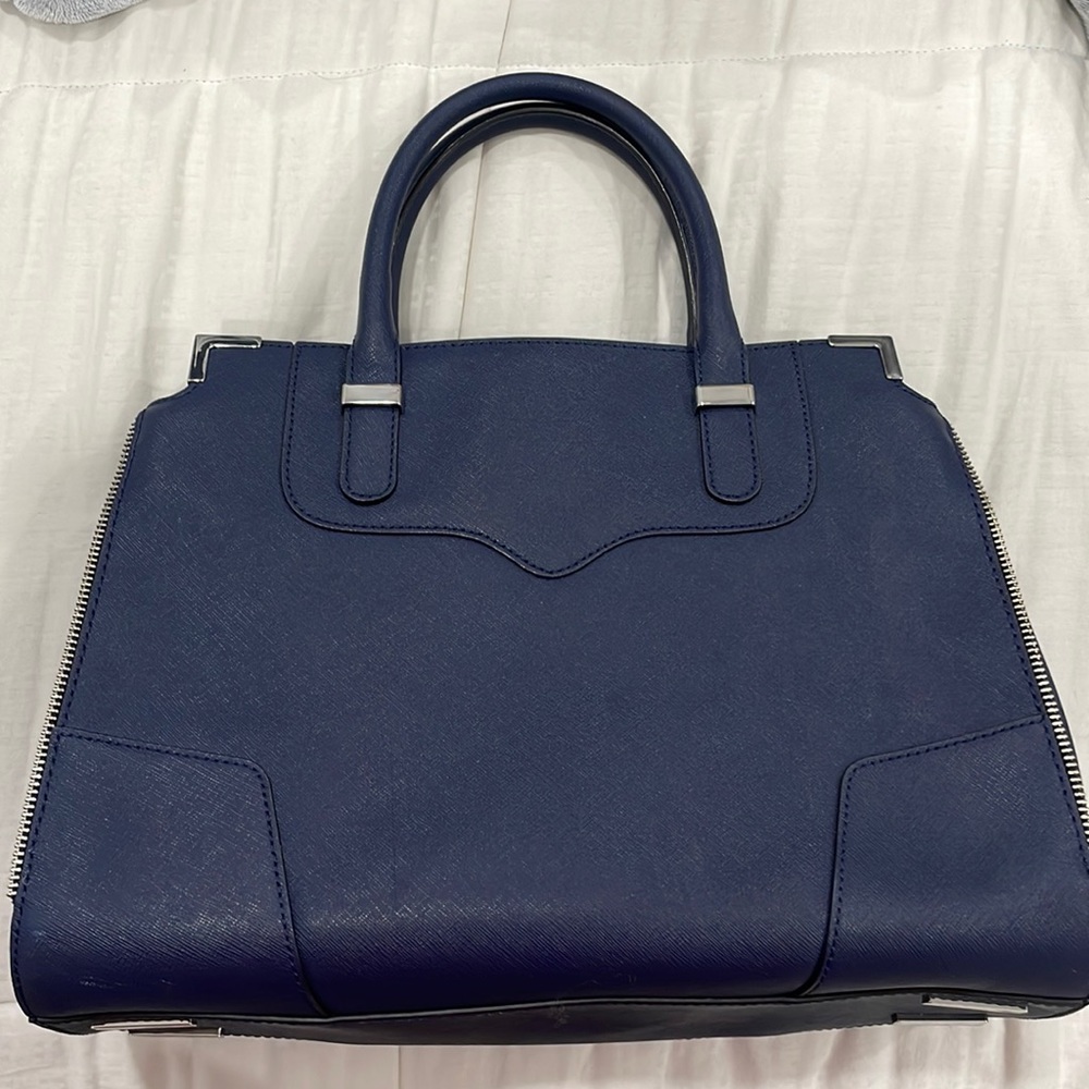 Navy Blue Rebecca Minkoff hang bag. Multiple compartments inside. 2 handles